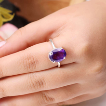 Load image into Gallery viewer, Amethyst diamond cut oval ring worn on finger, enhancing spiritual awareness, intuition, protection and inner peace.
