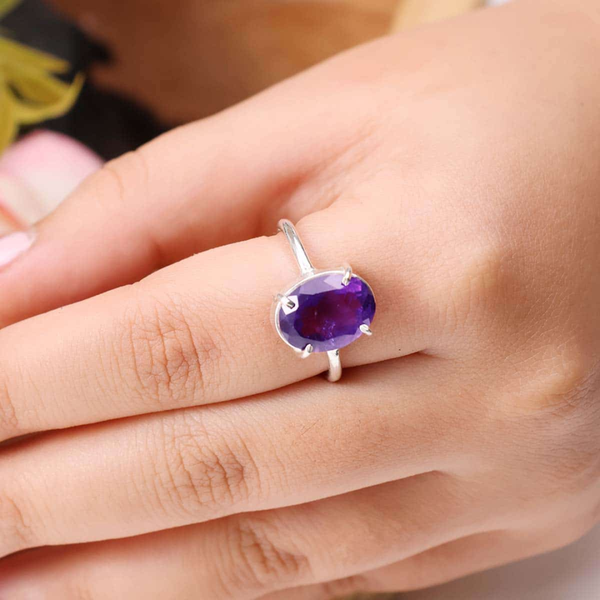 Amethyst diamond cut oval ring worn on finger, enhancing spiritual awareness, intuition, protection and inner peace.