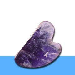 Purple Amethyst Gua Sha stone for face care, known for calming, soothing and detox effects