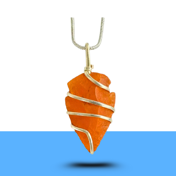 Arrowhead-shaped carnelian gemstone necklace symbolizing confidence and vitality