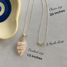 Load image into Gallery viewer, Arrowhead-shaped rose quartz pendant necklace promoting love and emotional healing

