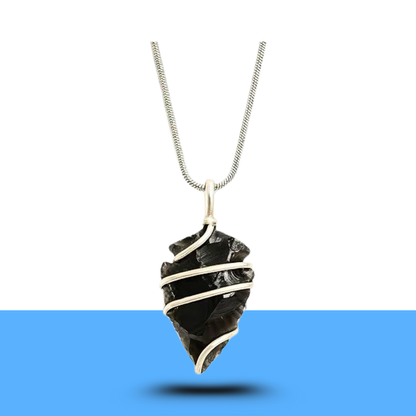 Black obsidian arrowhead pendant with chain displayed on a clean white background