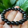 Protection & Clean Energy - Black Obsidian Bracelet for a strong daily reset - On Hand View | Natural Obsidian, Seven Chakra Crystal Bracelet for Evil Eye Protection & Negative Energy Shield