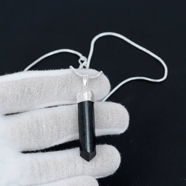 Close-up shot of a Black Tourmaline pencil-cut pendant