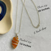 Polished carnelian crystal pendant on a metal chain for energy and creativity