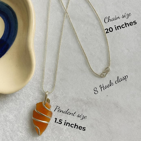 Polished carnelian crystal pendant on a metal chain for energy and creativity