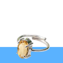 Load image into Gallery viewer, Citrine adjustable diamond cut ring on a clean white and blue minimalist background, symbolizing joy, success and abundance.
