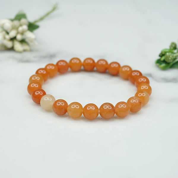 Model wearing a stylish Red Aventurine bracelet to highlight its elegance and aesthetic appeal. Get to know more about the Red Aventurine benefits