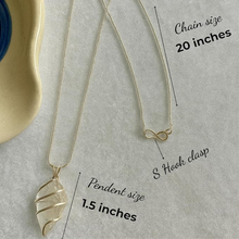 Load image into Gallery viewer, Transparent clear quartz gemstone pendant showcased on a silver backdrop for jewelry display
