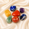 7 Chakra Tumble Tumble Set displayed fully on white silk cloth to show its natural colour, shape and finish