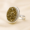 Pyrite Adjustable Ring displayed fully on white silk cloth to show its natural colour, shape and finish