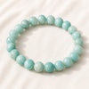 Amazonite Bracelet displayed fully on white silk cloth to show its natural colour, shape and finish