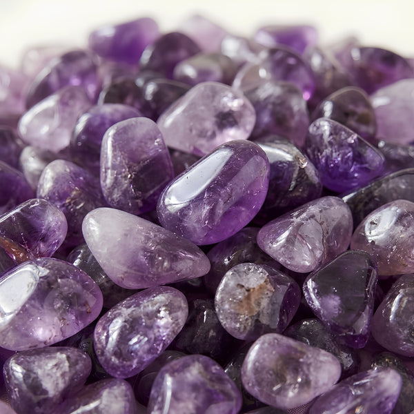 Close-up of authentic natural Amethyst showing crystal texture, colour and craftsmanship – amethyst chips stone symbol of serenity wisdom and spiritual