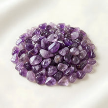 Load image into Gallery viewer, Amethyst Chips displayed fully on white silk cloth to show its natural colour, shape and finish
