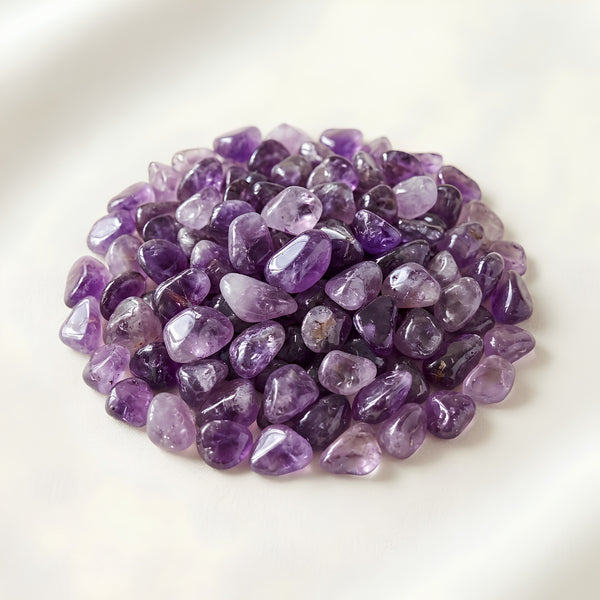 Amethyst Chips displayed fully on white silk cloth to show its natural colour, shape and finish