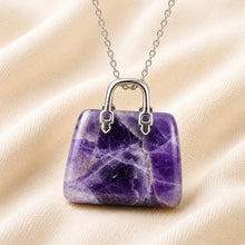 Load image into Gallery viewer, Close-up of authentic natural Amethyst showing crystal texture, colour and craftsmanship – amethyst mini handbag pendant symbol of peace intuition and rest
