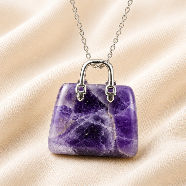 Close-up of authentic natural Amethyst showing crystal texture, colour and craftsmanship – amethyst mini handbag pendant symbol of peace intuition and rest