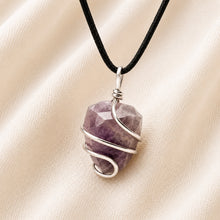 Load image into Gallery viewer, Close-up of authentic natural Amethyst showing crystal texture, colour and craftsmanship – amethyst tumble pendant symbol of serenity wisdom and spiritual
