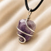 Amethyst Tumble Pendant displayed fully on white silk cloth to show its natural colour, shape and finish