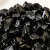 Close-up of authentic natural Black Obsidian showing crystal texture, colour and craftsmanship – black obsidian chips stone symbol of protection grounding and