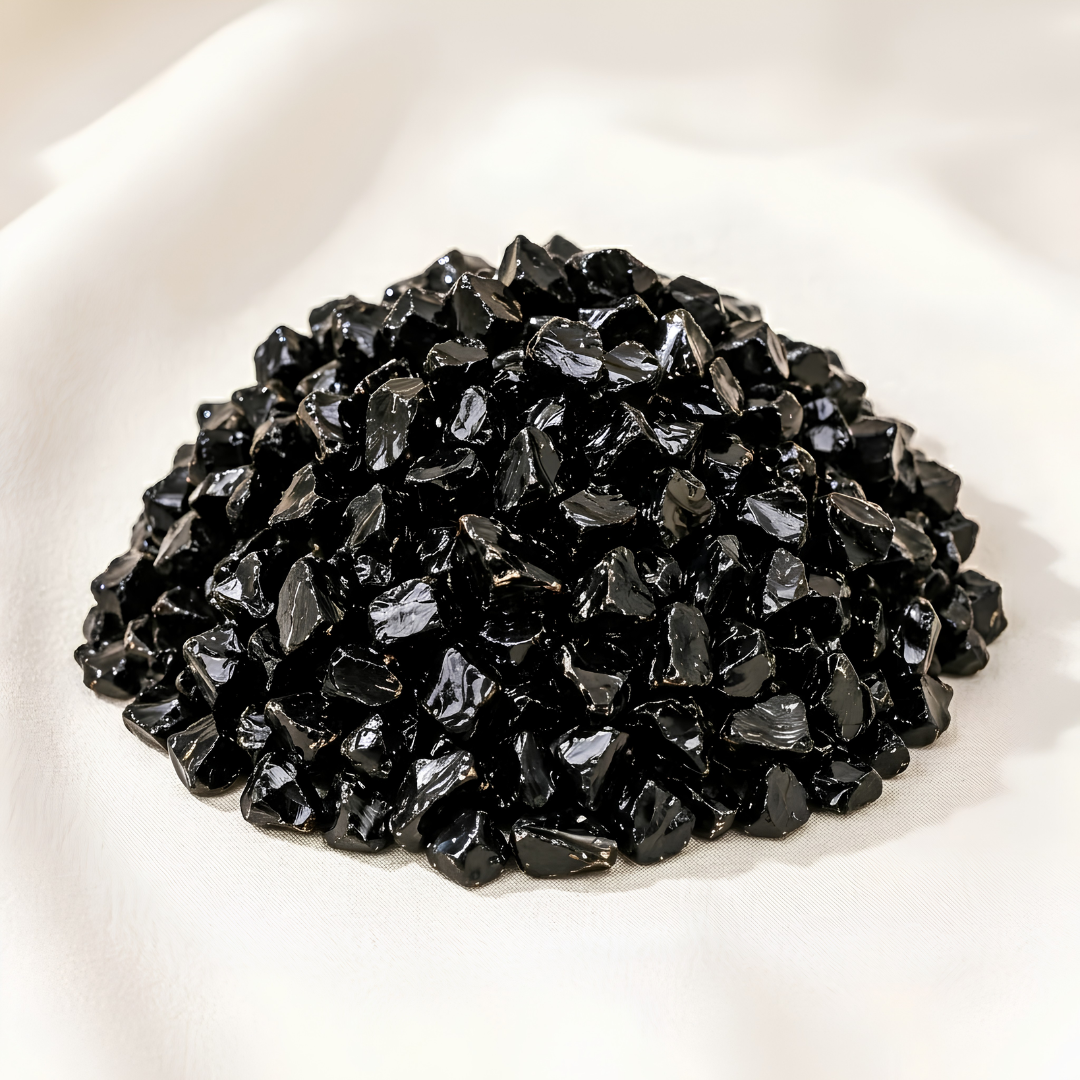 Black Obsidian Chips displayed fully on white silk cloth to show its natural colour, shape and finish