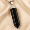 Close-up of authentic natural Black Obsidian showing crystal texture, colour and craftsmanship – black obsidian pencil pendant symbol of protection grounding