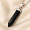 Close-up of authentic natural Black Onyx showing crystal texture, colour and craftsmanship – black onyx pencil pendant symbol of strength stamina and discipline