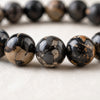 Close-up of authentic natural Black Picasso Jasper showing crystal texture, colour and craftsmanship