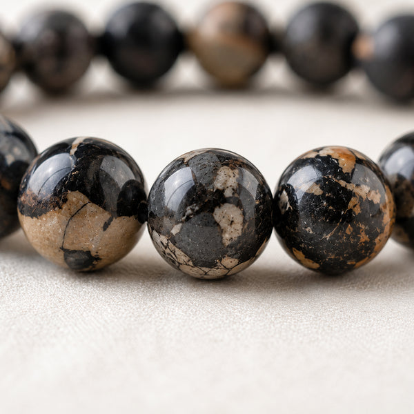 Close-up of authentic natural Black Picasso Jasper showing crystal texture, colour and craftsmanship