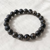 Black Picasso Jasper Bracelet displayed fully on white silk cloth to show its natural colour, shape and finish