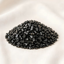 Load image into Gallery viewer, Black Tourmaline Chips displayed fully on white silk cloth to show its natural colour, shape and finish
