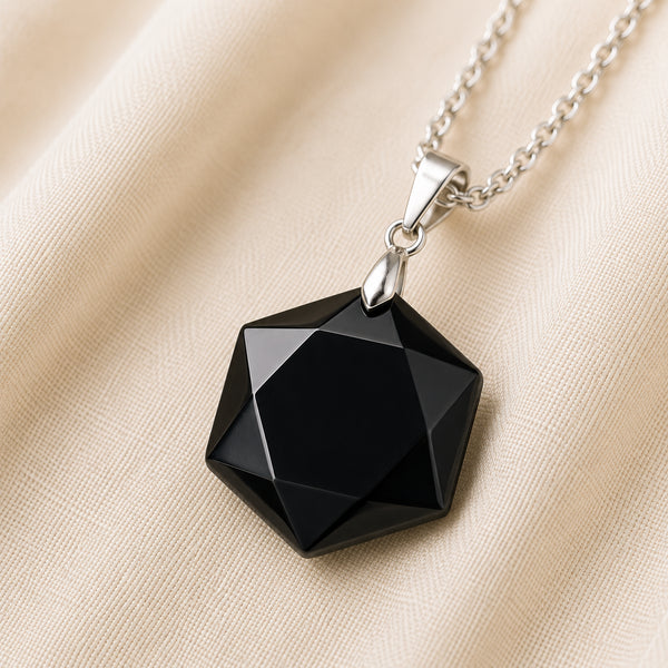 Close-up of authentic natural Black Tourmaline showing crystal texture, colour and craftsmanship – black tourmaline hexagon pendant symbol of guarding grounding