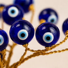 Load image into Gallery viewer, Close-up of authentic natural Evil Eye showing crystal texture, colour and craftsmanship
