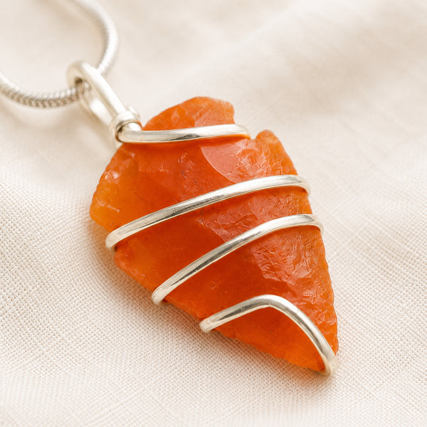 Close-up of authentic natural Carnelian showing crystal texture, colour and craftsmanship