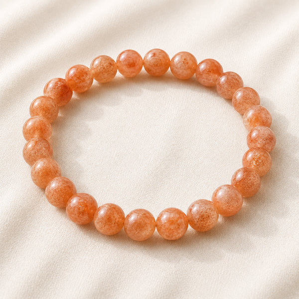 Carnelian Bracelet displayed fully on white silk cloth to show its natural colour, shape and finish