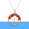 Carnelian Tree of Life Pendant displayed fully on white silk cloth to show its natural colour, shape and finish