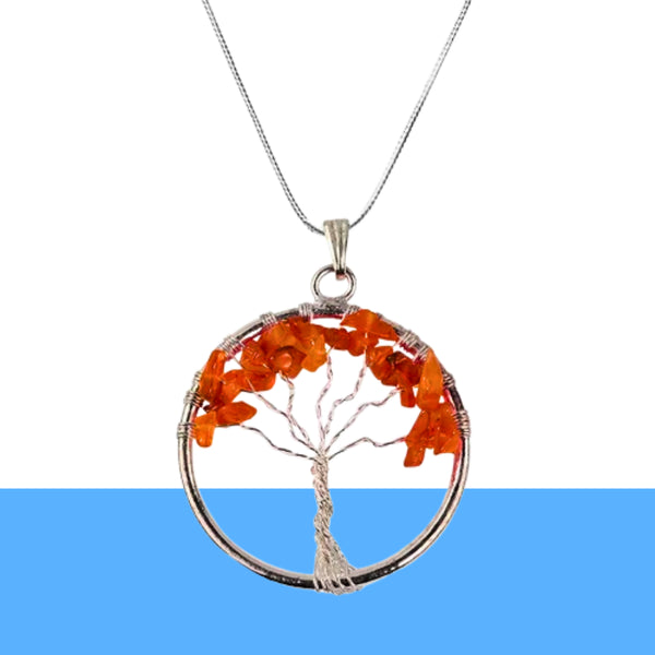 Carnelian Tree of Life Pendant displayed fully on white silk cloth to show its natural colour, shape and finish