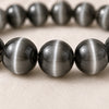 Close-up of authentic natural Cat Eye showing crystal texture, colour and craftsmanship