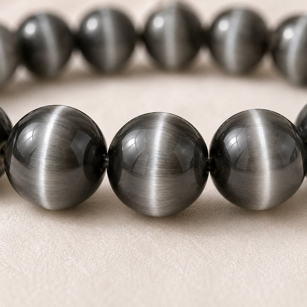 Close-up of authentic natural Cat Eye showing crystal texture, colour and craftsmanship