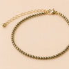 Pyrite Anklet with Free Selenite Charging Plate | Wealth Walk & Confidence in shown with crystals placed for cleansing and charging use