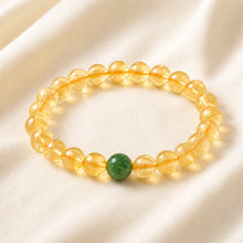 Load image into Gallery viewer, Citrine &amp; Green Jade Bracelet displayed fully on white silk cloth to show its natural colour, shape and finish

