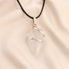 Clear Quartz Arrowhead Pendant displayed fully on white silk cloth to show its natural colour, shape and finish