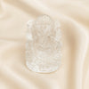 Sphatik Ganesh Idol displayed fully on white silk cloth to show its natural colour, shape and finish