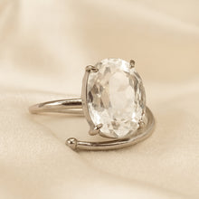 Load image into Gallery viewer, Clear Quartz Adjustable Ring displayed fully on white silk cloth to show its natural colour, shape and finish
