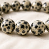 Close-up of authentic natural Dalmatian Jasper showing crystal texture, colour and craftsmanship