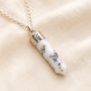 Dendrite Pencil Pendant displayed fully on white silk cloth to show its natural colour, shape and finish