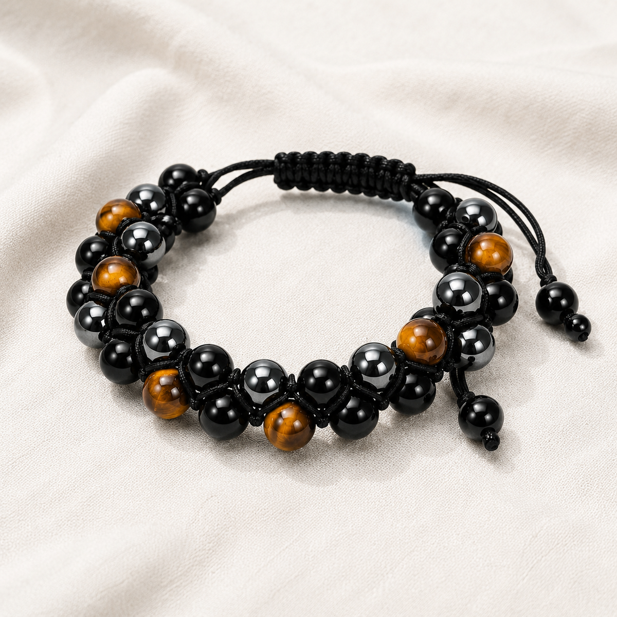 Dual Layer Triple Protection Bracelet displayed fully on white silk cloth to show its natural colour, shape and finish