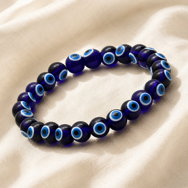 Evil Eye Bracelet displayed fully on white silk cloth to show its natural colour, shape and finish