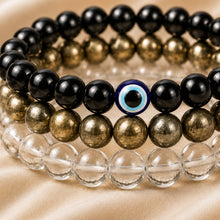 Load image into Gallery viewer, Close-up of authentic natural Clear Quartz, Evil Eye and Pyrite showing crystal texture, colour and craftsmanship
