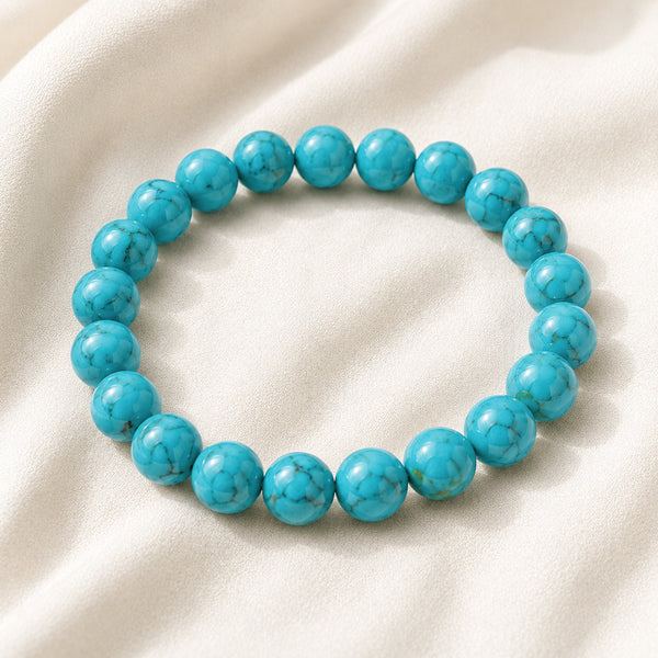 Firoza Bracelet displayed fully on white silk cloth to show its natural colour, shape and finish